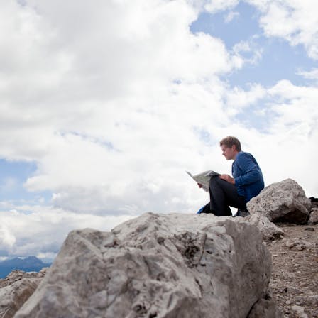 Man on mountain, rock, sitting