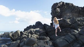 Girl climbing rocks