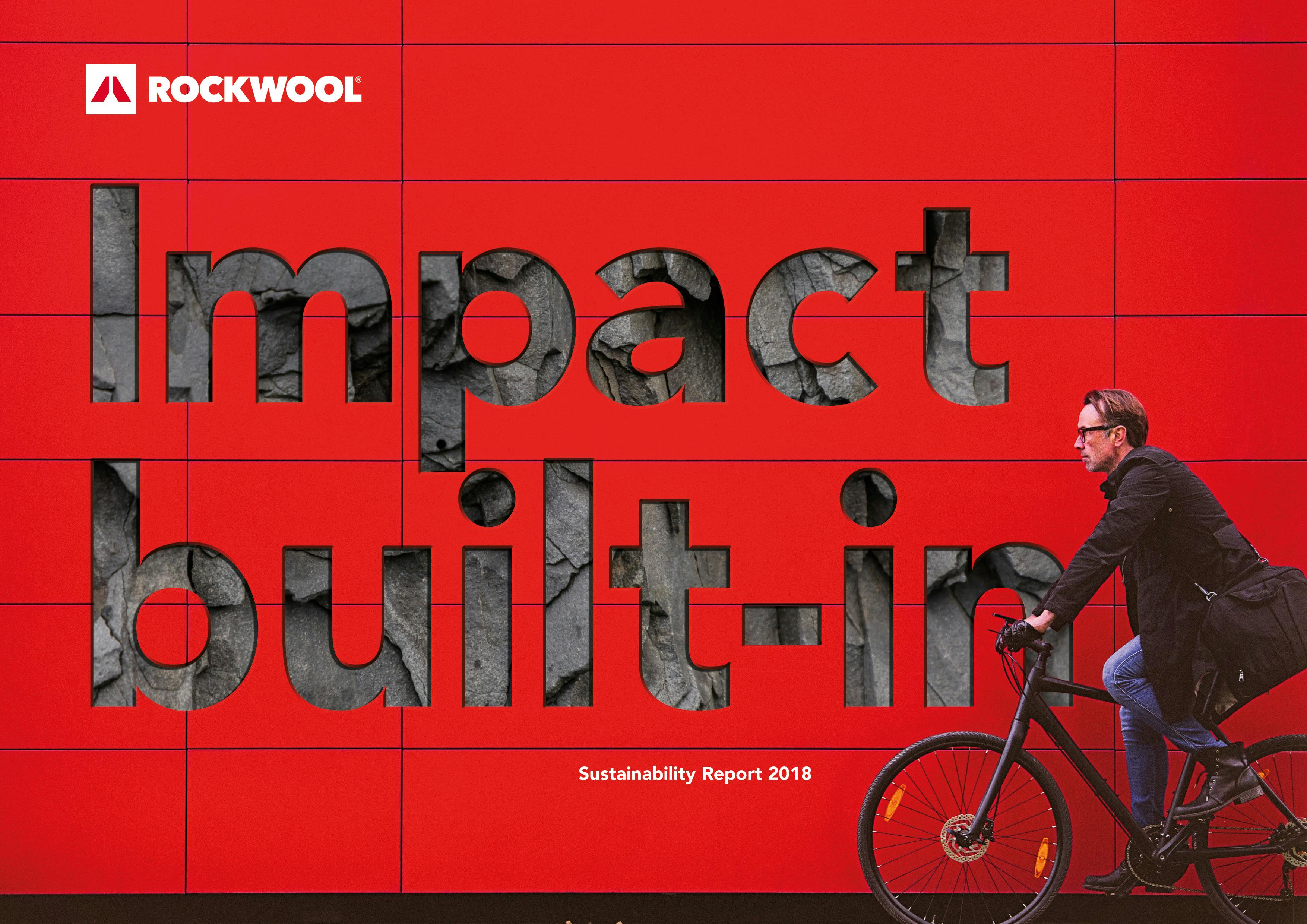 WILL BE DELETED  (safety issues) Man riding a bicycle in front of a red wall. Used for Sustainability Report 2018.