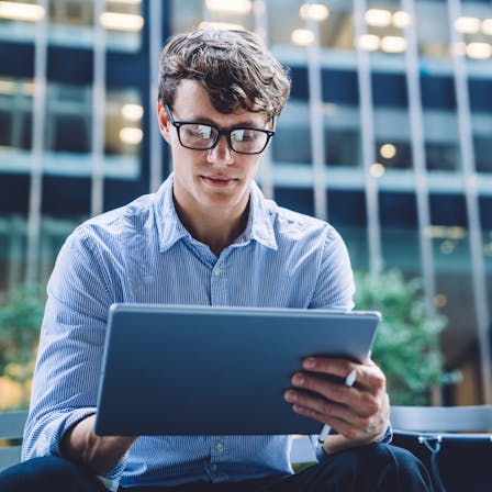 Young man using a tablet. Photo used in Sustainability Report 2019.

People, person, man, young man