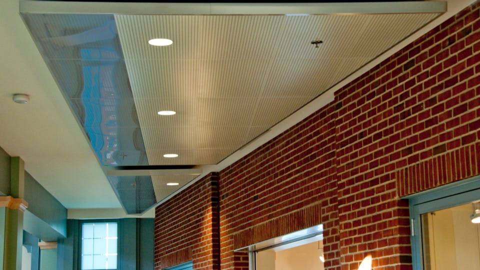 Featured products: Rockfon® Planostile™ Snap-in Metal Panel Ceiling System - Rockfon® Infinity™ Standard Perimeter Trim