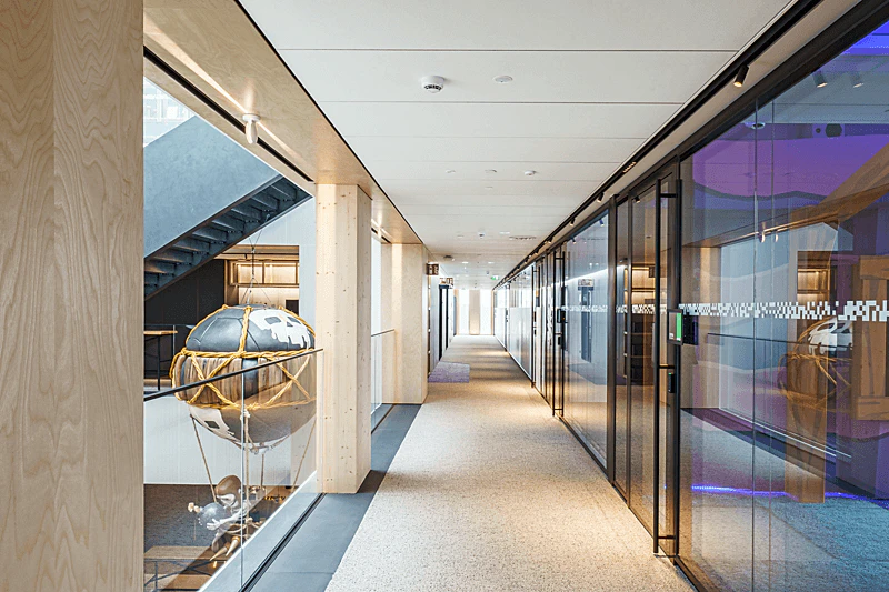 Corridor in office Wood City in Helsinki Finland with Rockfon Sonar in M-edge