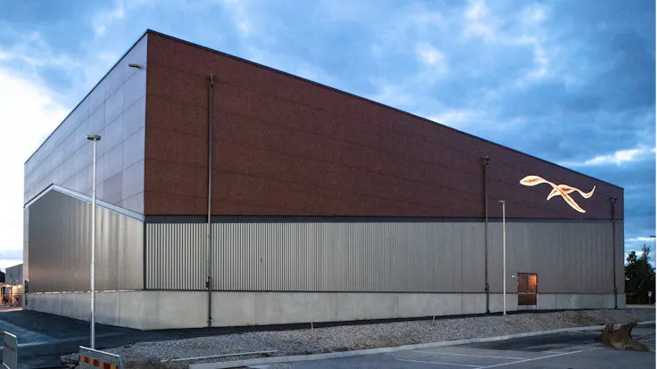 Sports hall 'Lärkan' in Sala, Sweden cladded with Rockpanel Stones Mineral Rust and Basalt Iron facade cladding.