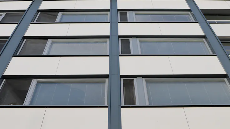 As Oy Kotikannas Case Study FinlandRockpanel Colours RAL9010, RAL7024 and RAL7031