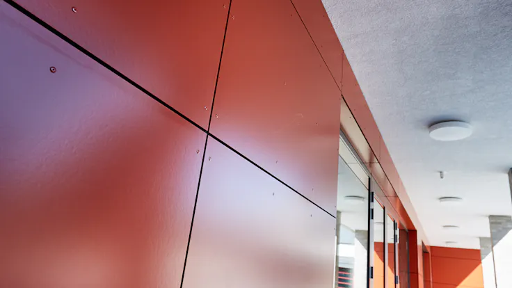 The Christophorus school in Mülheim-Kärlich (Germany) with (engraved) Rockpanel Metallics and Rockpanel Colours exterior cladding boards