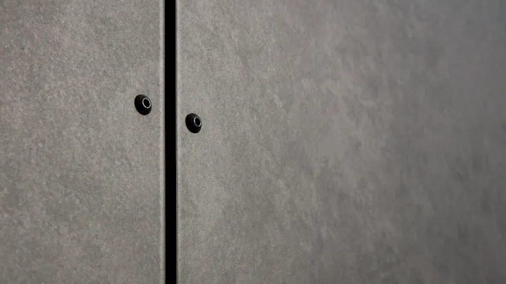Sports hall 'Lärkan' in Sala, Sweden cladded with Rockpanel Stones Mineral Rust and Basalt Iron facade cladding.