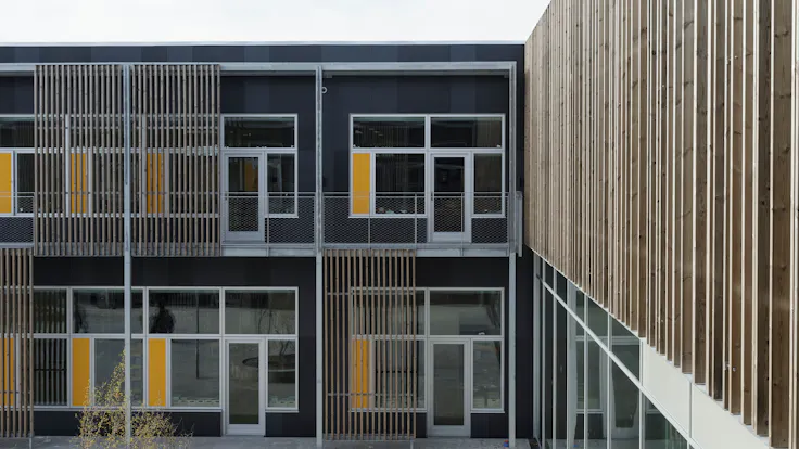 Klostermarksskolen in Roskilde, Denmark cladded with Rockpanel Colours RAL 7016 and RAL 7021 facade cladding