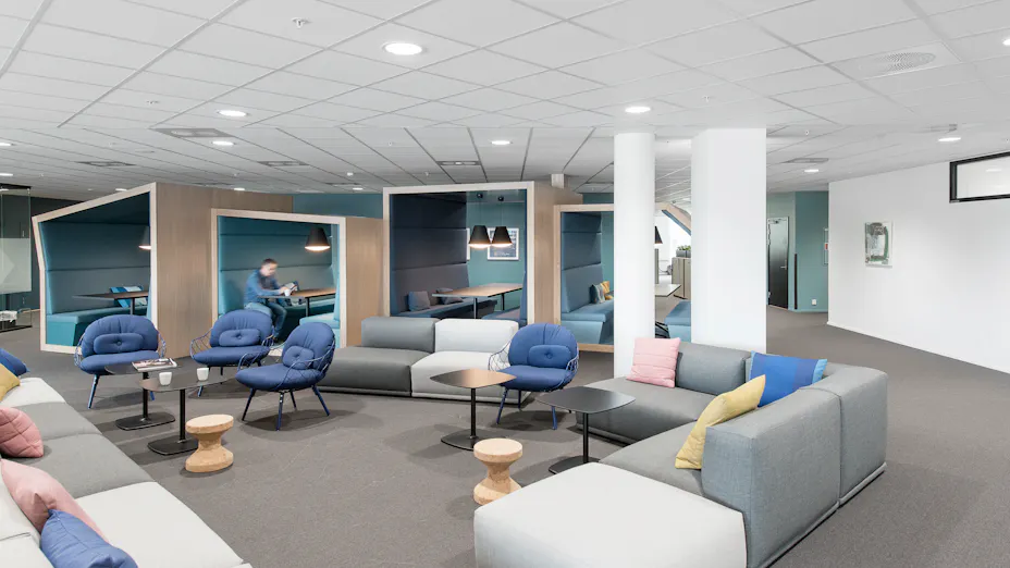 Rockfon Sonar acoustic ceiling tiles installed with Chicago Metallic suspension system in open office environment.