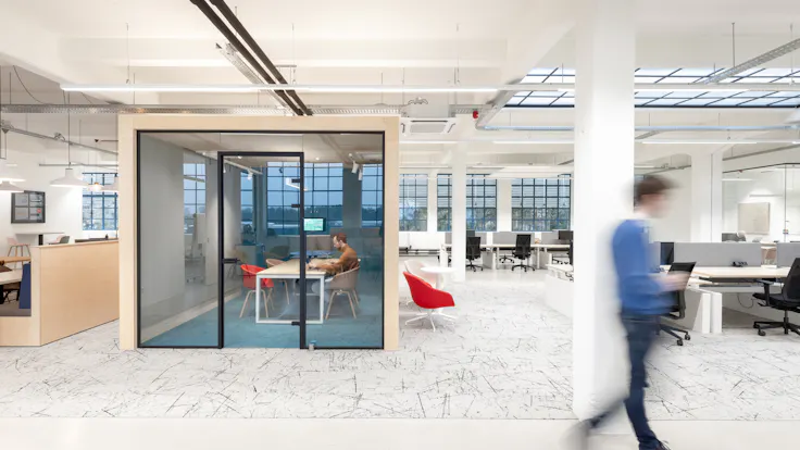 Open Plan Office in intoAction in Best Netherlands with Rockfon Eclipse A-Edge and Rockfon VertiQ A24-Edge
