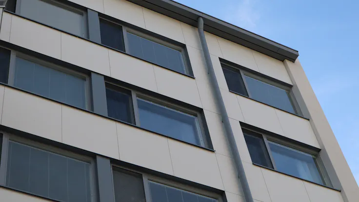 As Oy Kotikannas Case Study FinlandRockpanel Colours RAL9010, RAL7024 and RAL7031