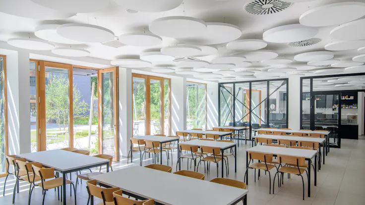 Canteen in COPaG high school in Prague Czech Republic with Rockfon Eclipse A-Edge