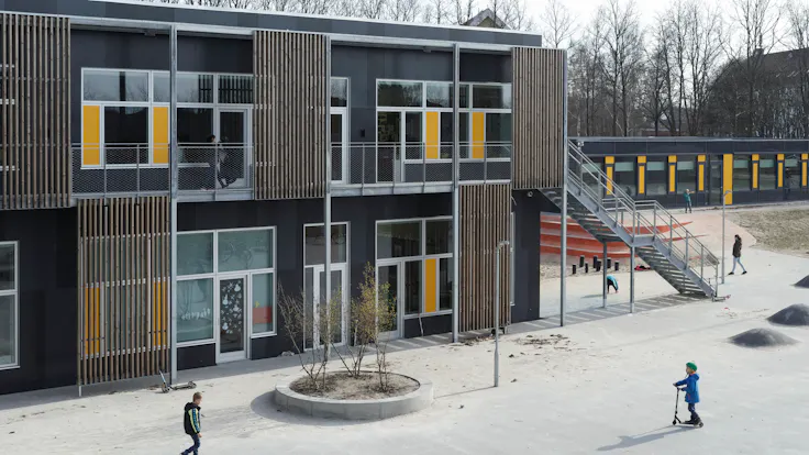 Klostermarksskolen in Roskilde, Denmark cladded with Rockpanel Colours RAL 7016 and RAL 7021 facade cladding