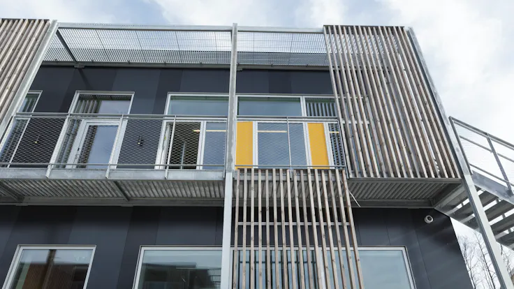 Klostermarksskolen in Roskilde, Denmark cladded with Rockpanel Colours RAL 7016 and RAL 7021 facade cladding
