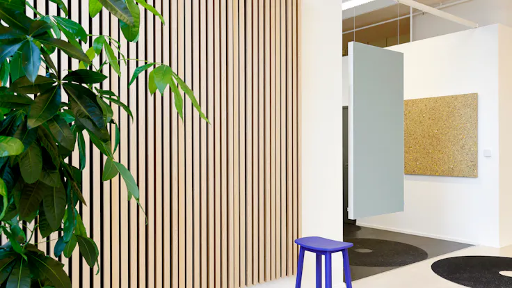 Corridor in INR Iconic Nordic Rooms in Espoo Finland with Rockfon Canva Hanging Divider and Rockfon Lamella and Rockfon Senses