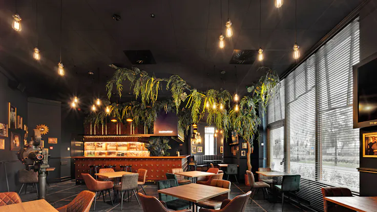 Restaurant of Plopsa hotel in De Panne Belgium with Rockfon Color-all Charcoal in D-edge