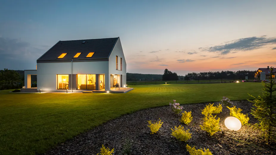 Smart home seen from outside at dusk