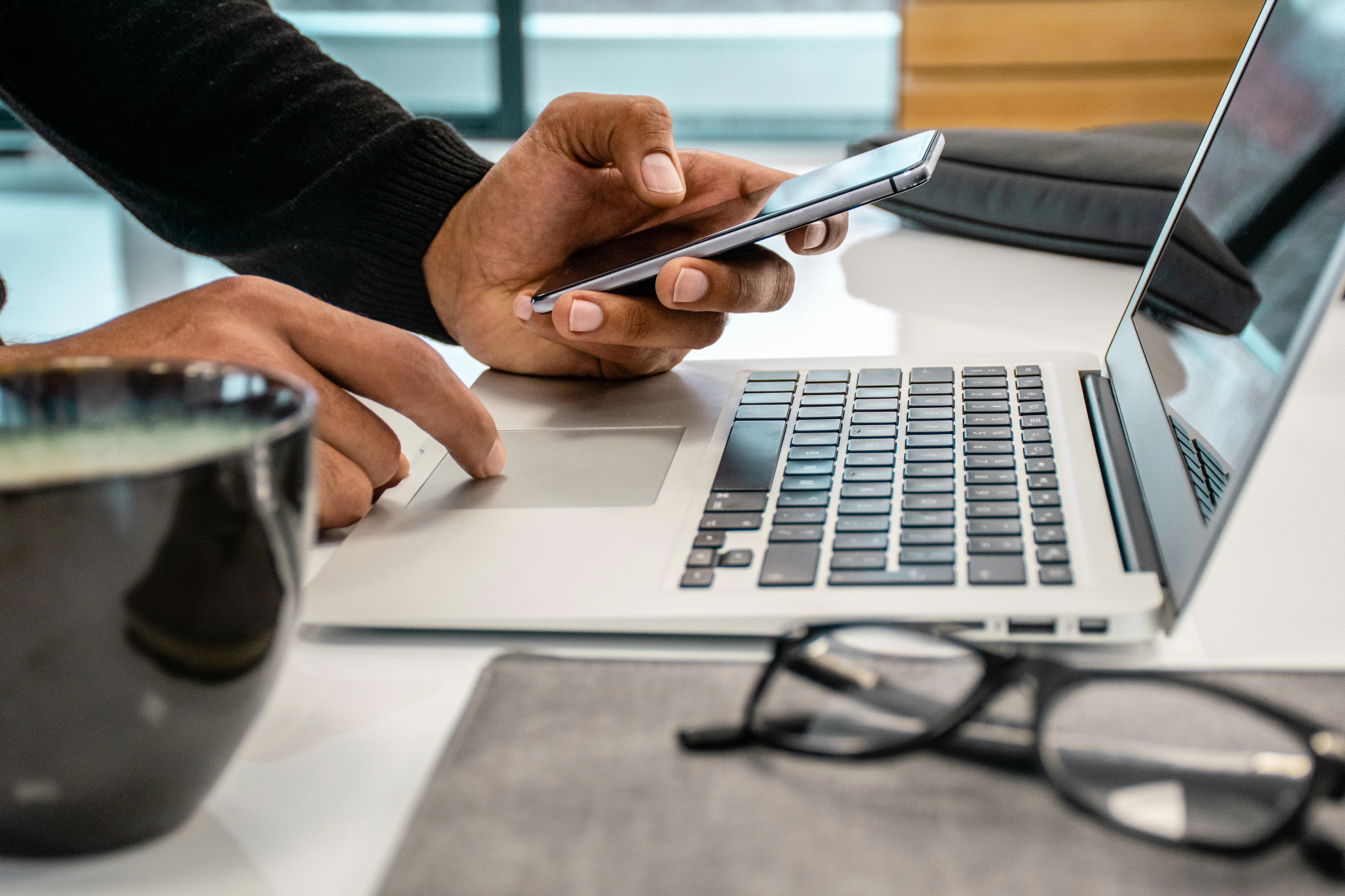 Working from home image on laptop and smartphone mobile phone remote employee
