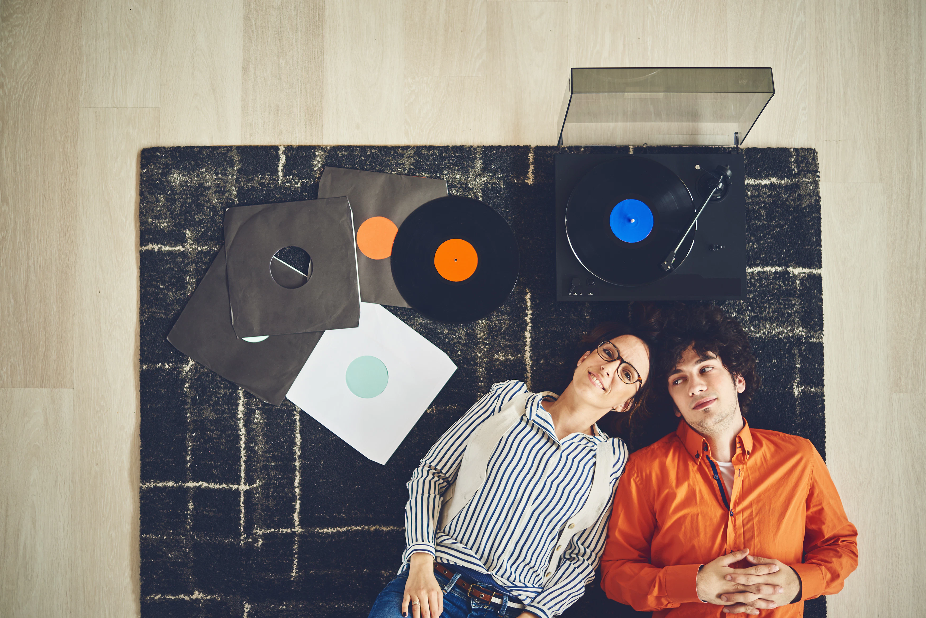 people on the floor - record player