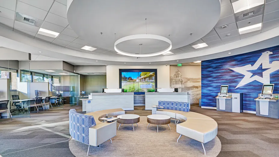 Travis Credit Union lobby features Rockfon Artic stone wool ceiling tiles installed with drywall suspension grid