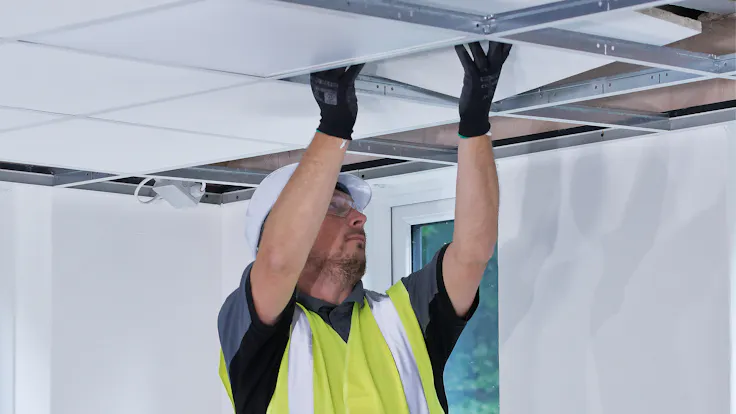 Suspended ceiling installer in the UK installing Rockfon Tropic A Edge. Installer, installing, ceiling, tiles