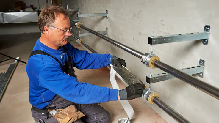 Reference case, TECLIT, Kolding Sygehus, Hospital, technical insulation, ITI, lamella mat, pipe section, case study, HVAC, cooling, Arno Pedersen, flex tape, hanger