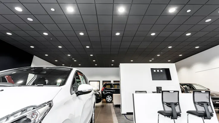Peugeot Showroom,United Kingdom,Sudbury,Suffolk,Scaramanga Design,Underwoods Motor Group,Chris Ball GGS Photography,ROCKFON Color-all,charcoal,Chicago Metallic T24 Click 2890