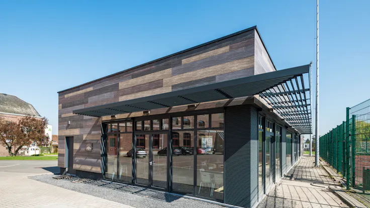 Sale de Sports in Celles, Belgium cladded with Rockpanel Woods facade cladding