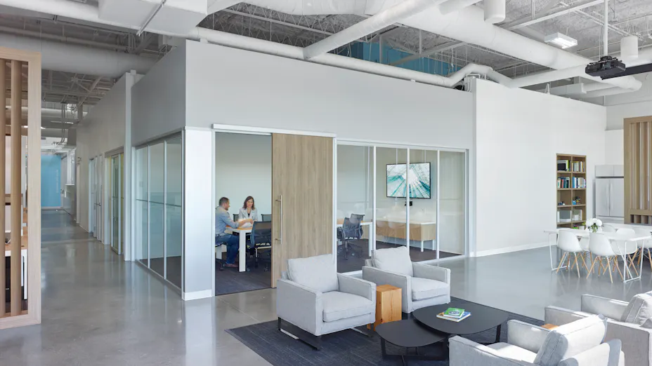 Rockfon ceiling tiles and panels installed in Movement Mortgage open office design.