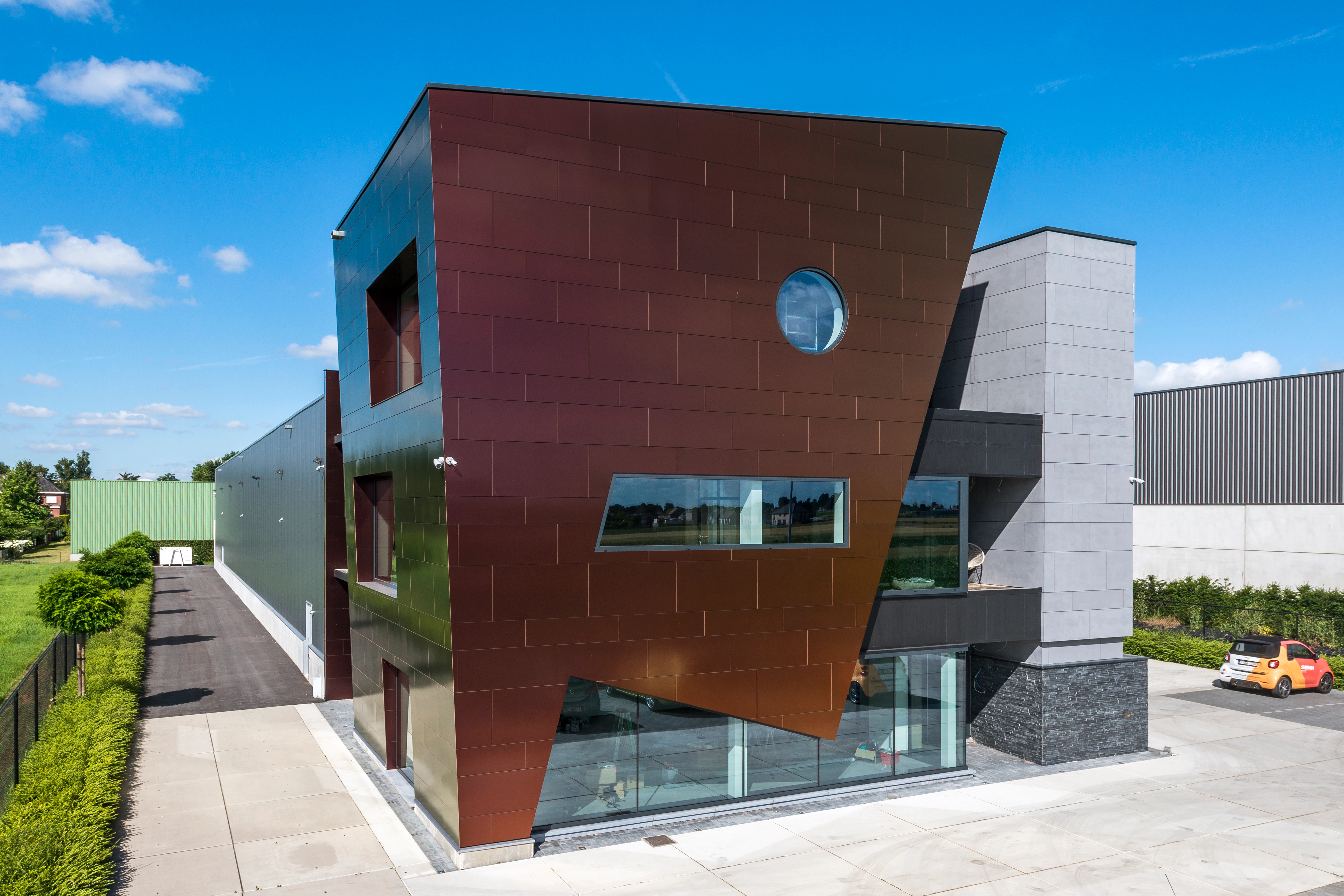 Sherwin office in Kortenberg, Belgium cladded with Rockpanel Chameleon facade cladding.
